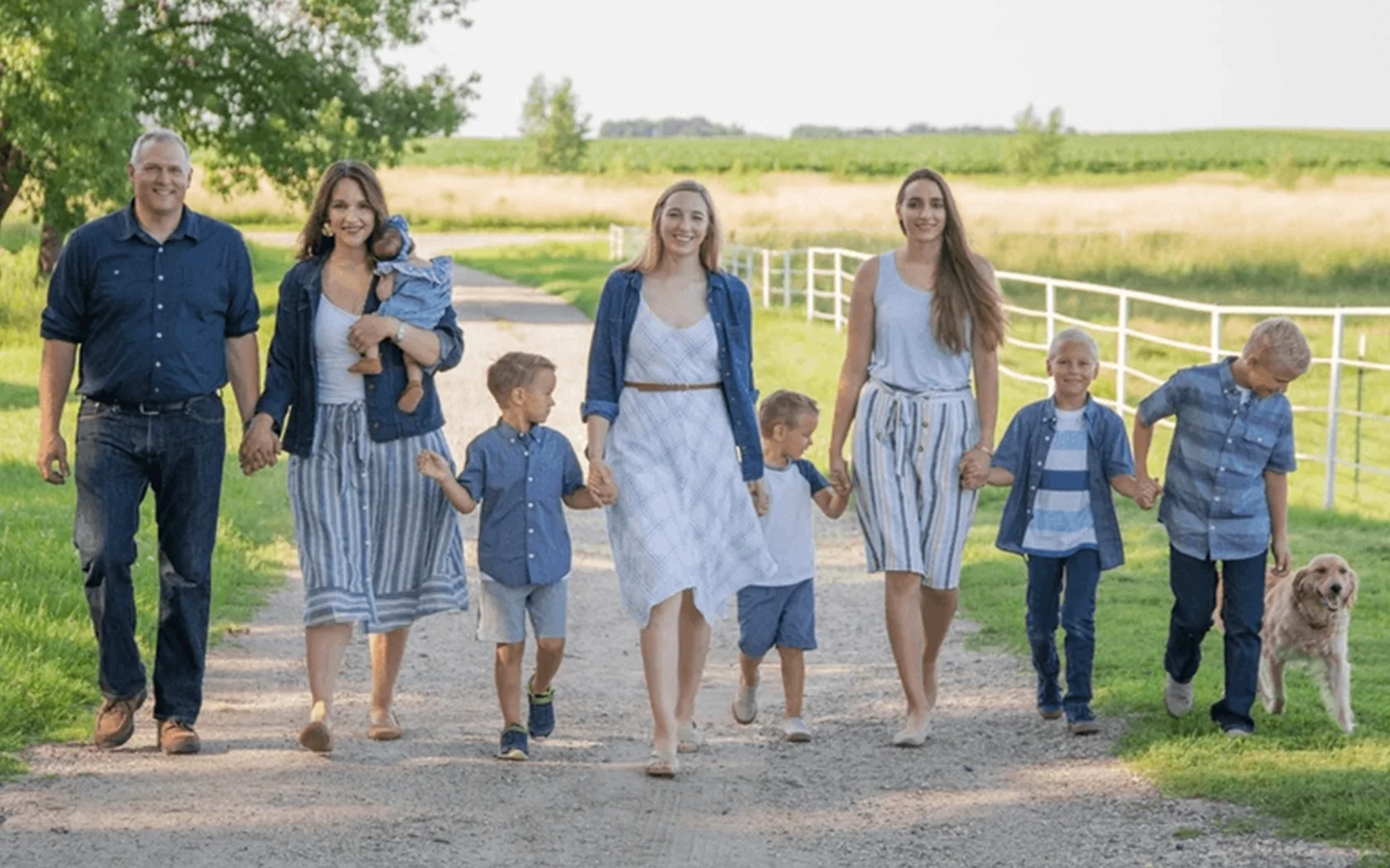 The BrookeMarie family with their dog outdoors